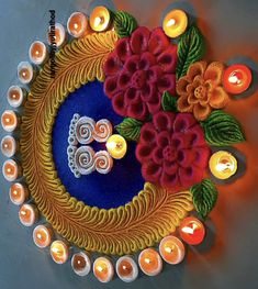 a decorated plate with candles and flowers on it