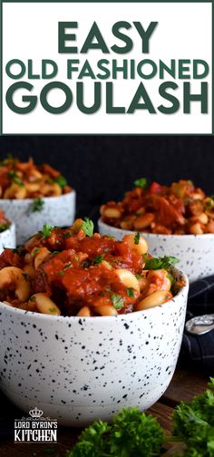 three bowls filled with pasta and sauce on top of a wooden table next to parsley