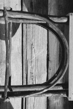 an old wooden door with a handle on the front and back side, in black and white