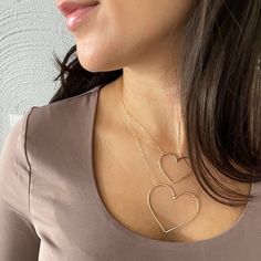 "Inspired by the popular hit show \"Emily in Paris\", our 'I Heart Paris' Necklace celebrates love in a grand way. This stunning handmade piece glows and literally goes with anything from jeans and a tee to a little black dress for a night out on the town.  Thick necklace is handmade for you in our Massachusetts studio, made of sterling silver or 14kt gold fill for long-term worry-free wear.   Available in 2 sizes: Medium Heart measures approximately 1.25 inches wide by 1.25 inches long.  Large I Heart Paris, Trending Necklace, Thick Gold Band, Paris Necklace, Initial Bar Necklace, Thick Necklace, Lucky Charm Necklace, Vintage Art Deco Rings, Trending Necklaces