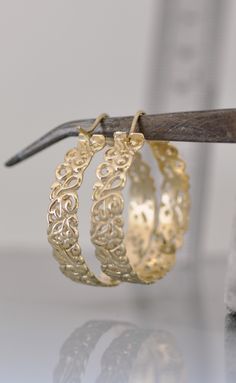 Large 14k solid gold hoop earrings. #gooldhoop #14kgoldearrings #14kgoldhoopearrings #hoopearrings #largehoop Gold Hoop Earrings With Intricate Design, Gold Hoop Earrings Stamped 14k For Wedding, Small Hoop Filigree Earrings As Gift, Brass Hoop Earrings With Intricate Design, Round Filigree Hoop Earrings For Anniversary, Filigree Round Hoop Earrings For Anniversary, Small Filigree Hoop Earrings As Gift, Intricate Design Hoop Earrings For Anniversary, Gift Hoop Earrings With Intricate Design