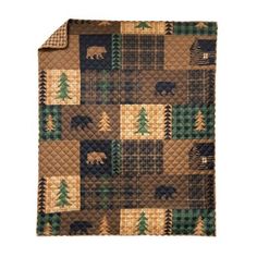 a quilted blanket with bears and pine trees on it, against a white background