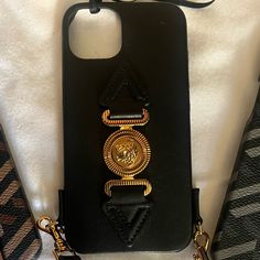 Brand New Iphone 12/13 Iphone Case This Cute, Popping Phone Case From Versace Is Elevated By Signature Medusa Head Motif And A Sturdy, Detachable Shoulder Strap. Black With Goldtone Hardware Leather & Synthetic Made In Italy Size Fits Iphone 12 Detachable Shoulder Strap,16"-19.5" Drop 5.75"W X 3"H Versace Phone Case, Luxury Gold Rectangular Phone Accessories, Luxury Rectangular Mobile Phone Bag, Luxury Black Phone Accessories, Elegant Black Phone Case, Elegant Black Rectangular Phone Case, Elegant Black Rectangular Phone Accessories, Luxury Black Mobile Phone Bag, Luxury Black Rectangular Phone Case