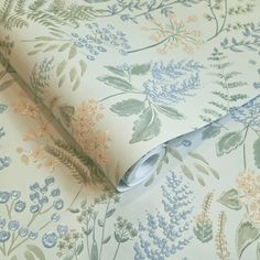 a floral wallpaper with blue and green flowers