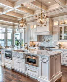 a large kitchen with an island in the middle and two ovens on each side