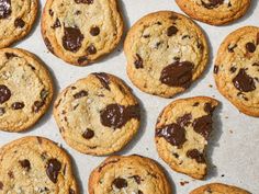 chocolate chip cookies are arranged on a baking sheet