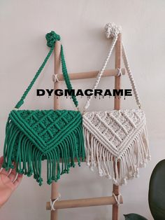 two macrame bags hanging on a wall with the words dygmacrame above them