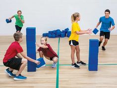 children playing with blocks in an indoor gym