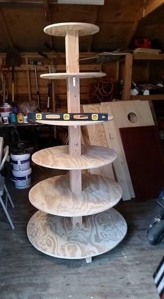 three tiered wooden stand in a garage