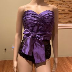 Silk Wrap Boned Bustier With Ruched Front And Long Ties Color Royal Purple 100% Silk Boning Ruched Can Be Tied At Front Or Back 43" Ties On Each Side 18" Armpit To Armpit 11" Length New With Tags Evening Bandeau Corset, Formal Strapless Ruched Corset, Party Tube Top With Ruched Bodice, Evening Ruched Overbust Corset, Ruffled Fitted Bodice Tops For Party, Ruffled Tops With Fitted Bodice For Parties, Evening Overbust Ruched Corset, Spring Party Corset With Ruched Bodice, Silk Bandeau Tube Top For Party