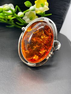 Baltic Amber Ring in sterling silver size 7 Materials: Silver 925, Baltic Amber Face of the ring: Height - 30mm, width -25mm Please note: Colors may vary slightly due to monitor display settings. Items in the photograph are not actual size. Closeup photos are taken. Please read the measurements. Thank you for visiting! PLEASE VISIT MY OTHER SHOP FOR UNIQUE HANDCRAFTED ARTISAN JEWELRY https://www.etsy.com/shop/AlenaZenaJewelry Elegant Amber Ring With Large Stone, Formal Cabochon Sterling Silver Rings, Formal Sterling Silver Cabochon Rings, Modern Sterling Silver Cabochon Rings, Sterling Silver Cabochon Rings For Formal Occasions, Formal Cabochon Ring In Sterling Silver, Luxury Amber Sterling Silver Rings, Classic Amber Sterling Silver Ring, Sterling Silver Jewelry With Large Amber Stone