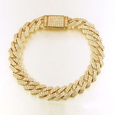 This stunning 12mm width solid men's Cuban chain bracelet features 6.50 carats diamonds professionally set pave on every link. The three diamonds flow beautifully throughout the links and hidden clasp and sparkle from every angle. Customize your bracelet and make it your own. Metal : 14K Solid Gold Approx. Weight : 40 Grams Setting Type : Pave Width : 12 mm Length : 8", 8.5", 9" Total Carat : 6.50 Carats Type : Natural Diamonds Shape : Round Cut Carat Weight : 6.50 Ct. Cut : Excellent Color : G- Trap Style, Cuban Chain Bracelet, Display Counter, Fashion Accessories Trends, Chain Diamond, Gold Wedding Jewelry, Ideas Jewelry, Cross Bracelet, Jewelry Statement