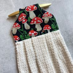 a close up of a piece of cloth with mushrooms on it