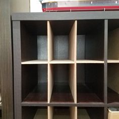 a book shelf with several shelves on each side