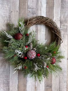 a christmas wreath on a wooden wall