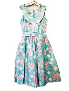 Robbie Bee Vintage 1980’s Beautiful Sky Blue with Pink Roses & Lillies Sleeveless Scoop Neck Belted Zip Back Cottagecore Dress Size 10. This dress has two side/pockets and is 100% cotton chintz. Measures 16” armpit to armpit, 16 1/2” shoulder to waist, 29” waist to hem, 46” Long. Excellent preowned condition, pictures do not do this dress justice, no rips, stains or tears. From a smoke free home. Shipped with USPS Priority Mail. Same or next day shipping. Bee Vintage, Cottagecore Dress, Beautiful Sky, Floral Sleeveless, Belted Dress, Priority Mail, Blue Floral, Pink Roses, Sky Blue