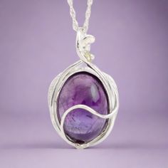 This "Murazaki" pendant necklace is handmade of 999 fine silver. It has been hand crafted in pure 99.9% solid silver in my workshop. It features a translucent Amethyst gemstone. "Murazaki" means "purple" in japanese. NOTE: This piece of jewelry has been created around this one-of-kind gemstone. It is unique and cannot be reproduced. Only one available! Handmade Spiritual Sterling Silver Necklace, Purple Artisan Sterling Silver Jewelry, Artisan Sterling Silver Purple Jewelry, Artisan Purple Sterling Silver Jewelry, Silver Wire Wrapped Necklaces, Artisan Sterling Silver Jewelry In Purple, Sterling Silver White Gold Necklaces With Natural Stones, White Gold Amethyst Pendant Jewelry, White Gold Amethyst Jewelry With Polished Finish