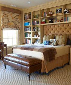 a large bed sitting in a bedroom next to a window