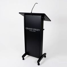 a black podium with the grand jersey logo on it