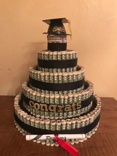 a graduation cake made out of stacks of money