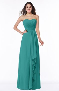 a woman in a strapless green dress