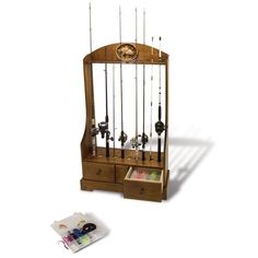 a wooden display case with fishing rods on it's sides and an open magazine