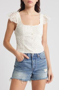 Turn on the romance in this top with a layer of pretty eyelet defining the fitted silhouette and forming the barely there cap sleeves. 17" length (size Medium) Button half placket Square neck Cap sleeves Partially lined 100% cotton Hand wash, dry flat Imported