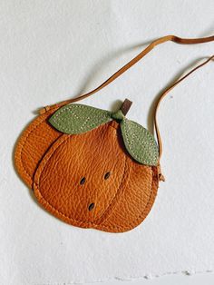 This oh-so-cute vegan leather Pumpkin Baby & Toddler Purse is a must-have for your little one. Not only is it stylish and on-trend, it also allows them to tote around their favorite tiny treasures in style!Material: Vegan leatherWARNING: Strap could be a choking hazard. Cute Brown Everyday Shoulder Bag, Summer Gift Leather Bags, Summer Leather Bag For Gift, Summer Leather Bags For Gifts, Cute Brown Shoulder Bag, Playful Bags For Spring Playtime, Cute Orange Bags For Daily Use, Cute Orange Bag For Daily Use, Cute Leather Shoulder Bag For School