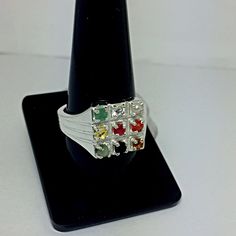 Genuine 925 Sterling Silver Navratan Ring Gemstone - Ruby , Emerald , Blue Sapphire, Yellow Sapphire, Hessonite, Cats Eye, Coral, Pearl, Cubic Zircona. Ring Size - No. ( US ) 8.25 , 9.50 , 9.75 , 10.50 QTY - 1 piece in this listing. The navratna or nine gems influencing the nine planets are: Ruby = Sun , Pearl = Moon, Red Coral = Mars, Emerald = Mercury, Yellow Sapphire = Jupiter, zircon = Venus, Blue Sapphire = Saturn, Hessonite = Rahu , Cat''s Eye = Ketu . Silver Round Jewelry For Navratri, Navaratna Ring, Navratan Rings For Women, Navratan Ring, Navratna Pendant, Yellow Sapphire, Red Coral, Lucky Charm, Blue Sapphire