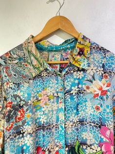 Johnny Was Floral Print Top! Has long sleeves, a classic collar, and buttons up the front. 100% rayon. Size large, please refer to measurements. In excellent condition! Approx. Measurements: Underarm to Underarm: 22" Sleeve Length: 25" Length: 29.5" Spring Multicolor Blouse With Collared Neckline, Multicolor Silk Collared Shirt, Multicolor Long Sleeve Silk Shirt, Long Sleeve Multicolor Silk Shirt, Fitted Button-up Viscose Blouse, Fitted Viscose Button-up Blouse, Multicolor Spring Shirt With Collared Neckline, Multicolor Collared Shirt For Spring, Silk Button-up Shirt With Floral Print