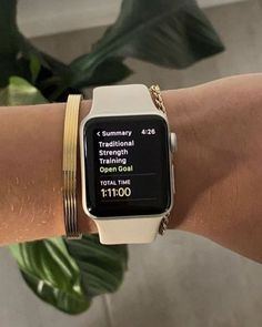 a person wearing a gold and white watch on their wrist with the text, traditional strength training open door total time $ 1 00