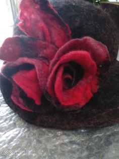 The hat is made from black fine wool and decorated with flowers in black and red. The method is wet felting- I use only soap an water. Adjustable Burgundy Felt Hat For Winter, Evening Wool Cloche Felt Hat, Handmade Adjustable Red Felt Hat, Red Adjustable Winter Felt Hat, Wet Felted Hats, Handmade Felt Hats, Victorian Hats, Black Hat, Cloche Hat