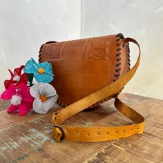 MADE IN MEXICO By: Mexican Artisans For: Women Color: tan brown Dimensions: 10.5 x 8 x 3.5 Details: 100% Authentic Leather Style: Crossbody | Shoulder Bag Embossed Design Adjustable & Non-Removable Strap: 22" Drop Clasp button closure Contact us for more detailsPLEASE READ BEFORE PURCHASE: The picture is an ACCURATE REPRESENTATION.Colors in the pictures may vary a little by effects of light. Each product is handmade from Mexico causing differentiation and minor imperfections in each piece making Saddle Bag With Adjustable Strap For Daily Use, Daily Saddle Bag With Adjustable Strap, Brown Satchel Shoulder Bag With Mobile Phone Pocket, Dark Tan Rectangular Bag With Adjustable Strap, Brown Satchel Backpack With Mobile Phone Bag, Rectangular Dark Tan Bag With Adjustable Strap, Cognac Saddle Bags With Adjustable Strap, Brown Satchel Flap Bag With Adjustable Strap, Brown Flap Satchel Bag With Adjustable Strap