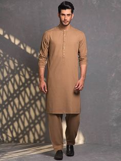 Color: Antique brassGorgeous kurta features embroidery details on collar, sleeves and placketComplement with matching shalwar  Additional Accessories:Peshawari Sandal / Khussa: US$50 Classic Unstitched Kurta For Formal Occasions, Classic Semi-formal Sets For Eid, Classic Unstitched Suit For Eid, Classic Unstitched Suit For Eid Semi-formal, Classic Unstitched Suit For Eid And Semi-formal Occasions, Classic Semi-formal Unstitched Suit For Eid, Classic Long Sleeve Traditional Wear For Eid, Classic Unstitched Kurta For Semi-formal Occasions, Classic Kurta With Naqshi For Festive Occasions