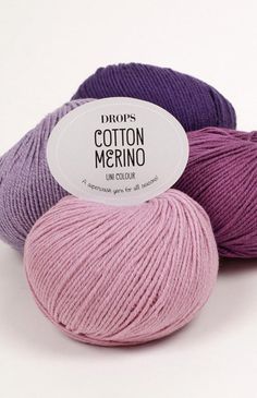 three balls of cotton merino in various colors