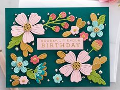 a handmade birthday card with flowers on it