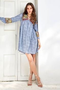 Celeste blue tunic dress featuring floral stripe print with thread embroidery detailing on the neck and sleeves. - Aza Fashions Spring V-neck Tunic With Embroidered Neckline, Floral Print Tunic Embroidered Dress, Embroidered Floral Tunic Dress, Spring Folk Style Dress With Boho Print, Spring Folk Dress With Boho Print, Blue V-neck Dress With Embroidered Hem, Blue Bohemian Dress With Embroidered Neckline, Blue Bohemian Embroidered Dress For Spring, Summer Tunic With Embroidered Sleeves