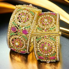 Jeweled Round Bangle For Wedding, Gold Cuff Bracelet For Weddings And Festivals, Ornate Cuff Bracelet For Weddings And Festivals, Meenakari Bridal Bangle Sets For Wedding, Temple Style Jeweled Bangle For Weddings, Ceremonial Festive Bangle With 17 Jewels, Temple Jewelry Style Jeweled Bangle For Wedding, Intricate Design Bangle For Marriage, Wedding Chandbali Temple Jewelry Bracelets