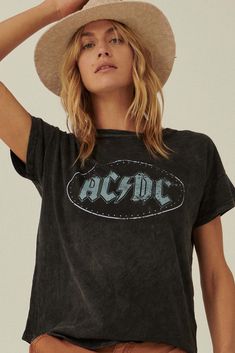 Mineral-washed graphic t-shirt. Vintage-style AC/DC logo graphic print. Metallic stud embellishment. Round neckline. Short drop-shoulder sleeves. Loose fit. 100% Cotton. Imported top designed and printed in Los Angeles, CA. Officially licensed AC/DC merchandise. Not eligible for discounts. Cheap Band Logo Graphic Tee, Cheap Cotton Rock Style T-shirt, Spring Stonewashed T-shirt In Washed Black, Edgy Washed Black T-shirt With Letter Print, Trendy Stonewashed Short Sleeve T-shirt, Edgy Acid Wash Short Sleeve T-shirt, Edgy Washed Black T-shirt For Spring, Trendy Stonewashed T-shirt For Spring, Spring Crew Neck Stonewashed T-shirt