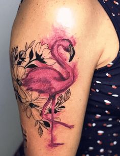 a flamingo tattoo on the arm and shoulder