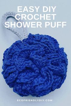 an easy crochet shower puff is shown in blue