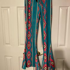 Nwt Aztec Flare Pants From Boutique. Colors Are Turquoise, Bright Pink,Tan And Black. Perfect Condition. Very Cute And Western. Turquoise Stretch Bottoms, Trendy Blue Festival Pants, Trendy Blue Pants For Festival, Stretch Turquoise Bottoms For Spring, Casual Fitted Turquoise Pants, Fitted Turquoise Casual Pants, Fitted Blue Pants For Vacation, Boutique Colors, Gold Sequin Pants