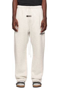 Essentials: Off-White Relaxed Lounge Pants | SSENSE Urban Cotton Sweats For Loungewear, Basic Cotton Sweats For Lounging, Urban Joggers With Letter Print For Loungewear, Urban Cotton Sweatpants For Loungewear, Urban Style Relaxed Fit Sweatpants For Loungewear, Urban White Loungewear Bottoms, Comfortable Streetwear Sweats With Ribbed Waistband, Cotton Sweats With Comfort Waistband For Streetwear, Comfort Waistband Cotton Sweats For Streetwear