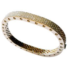 This stunning two section 18 karat Yellow gold bangle style bracelet is accented with 171 carefully matched white round brilliant diamonds weighing approximately 4.16 carat total. Inspired by art and fashion, Novel Collection is presenting its creativity and superlative craftsmanship. Absolutely unique pattern is reproduced in a retro design; easy to wear and highly versatile, this elegant concept will touch your essence. This piece was Hand made at the Novel Collection Jewelry Atelier, specializes in rare collectible pieces in Fancy color diamonds. Please inquire for additional details. We also have stock of other investment pieces which are unlisted. Kindly send us a message and we will be glad to respond with the piece that meets your description. Novel Collection is a recognized leader Diamond Bangle In Polished Yellow Gold, Luxury Gold Bangle With Brilliant Cut, Luxury Diamond Bangle With Polished Finish, Designer Diamond Bracelet With Brilliant Cut, Designer Bracelets With Brilliant Cut Diamonds, Luxury Diamond Bangle With Single Cut Diamonds, Luxury Single Cut Diamond Bangle Bracelet, Luxury Single Cut Diamond Bangle, Luxury Anniversary Bangle With Single Cut Diamonds