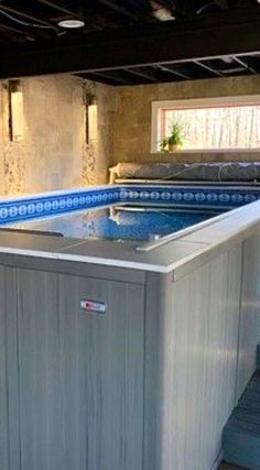 an outdoor hot tub with stairs leading up to it