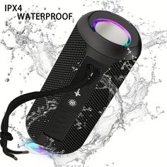 the waterproof speaker is on top of some water and has its light on it