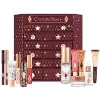 an assortment of cosmetics and lipsticks in a box with stars on the top,