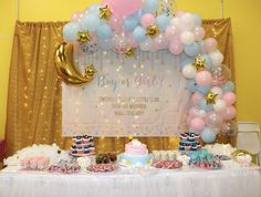 a baby shower party with balloons and cake