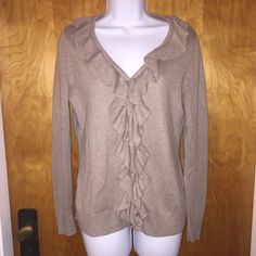 This Is A Super Cute And Soft Cardigan Sweater. It Is A Tan Beige Color. It Buttons All The Way Down And Has A Ruffled Trim. It Is Brand New And Has Never Been Worn. V-neck Ruffled Cardigan For Layering, V-neck Ruffled Winter Cardigan, Ruffled V-neck Cardigan For Layering, Ruffled V-neck Layering Cardigan, Elegant V-neck Ruffle Cardigan, Soft Cardigan, Way Down, Beige Color, St John