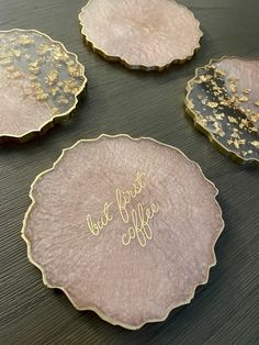 three pink and gold plates with the words, but first coffee written on one plate